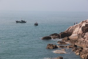 Fishermen in the water and out.