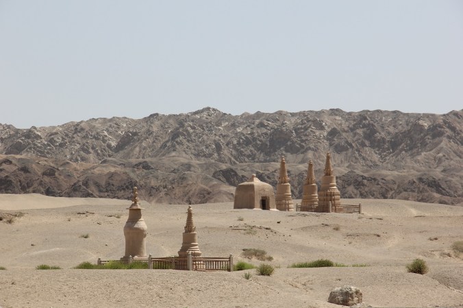 Somewhere over those hills, a thousand shining Buddhas shone.