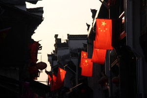 Chinese flags fly for national day along Tunxi's rooftops.