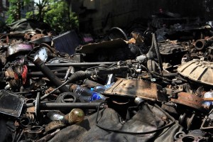 Piles of car parts spill out into the street in Chinatown.