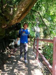 I walk past a series of small waterfalls and fail at not looking goofy.