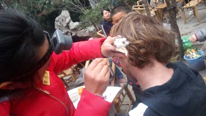 Getting my ears cleaned in People's Park.
