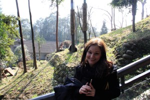 The Swede poses in front of a pair of panda cubs.