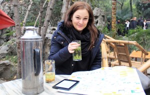 The Swede sips bamboo leaf tea. Buckwheat and the water thermos sit on the desk.