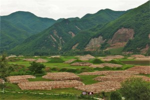 The burial mounds, built after the city was sacked.